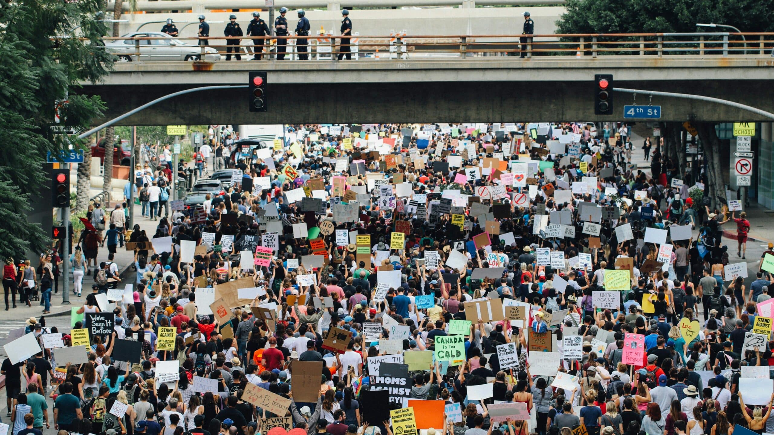 An image of a multitude of people at a protest, representing the vast global population for the celebration of World Population Day.