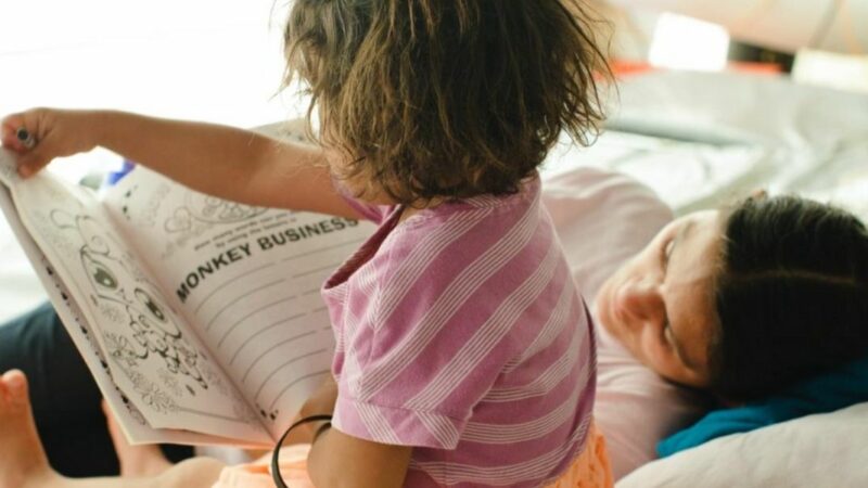 Child with mother reading