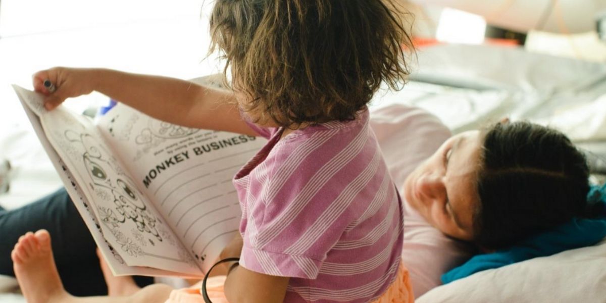 Child with mother reading
