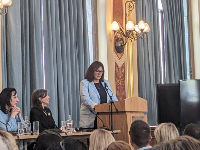 EU Commissioner Dubravka Suica speaking at a podium in the grand ballroom at the Foreign Commonwealth and Development Office during URC 2023