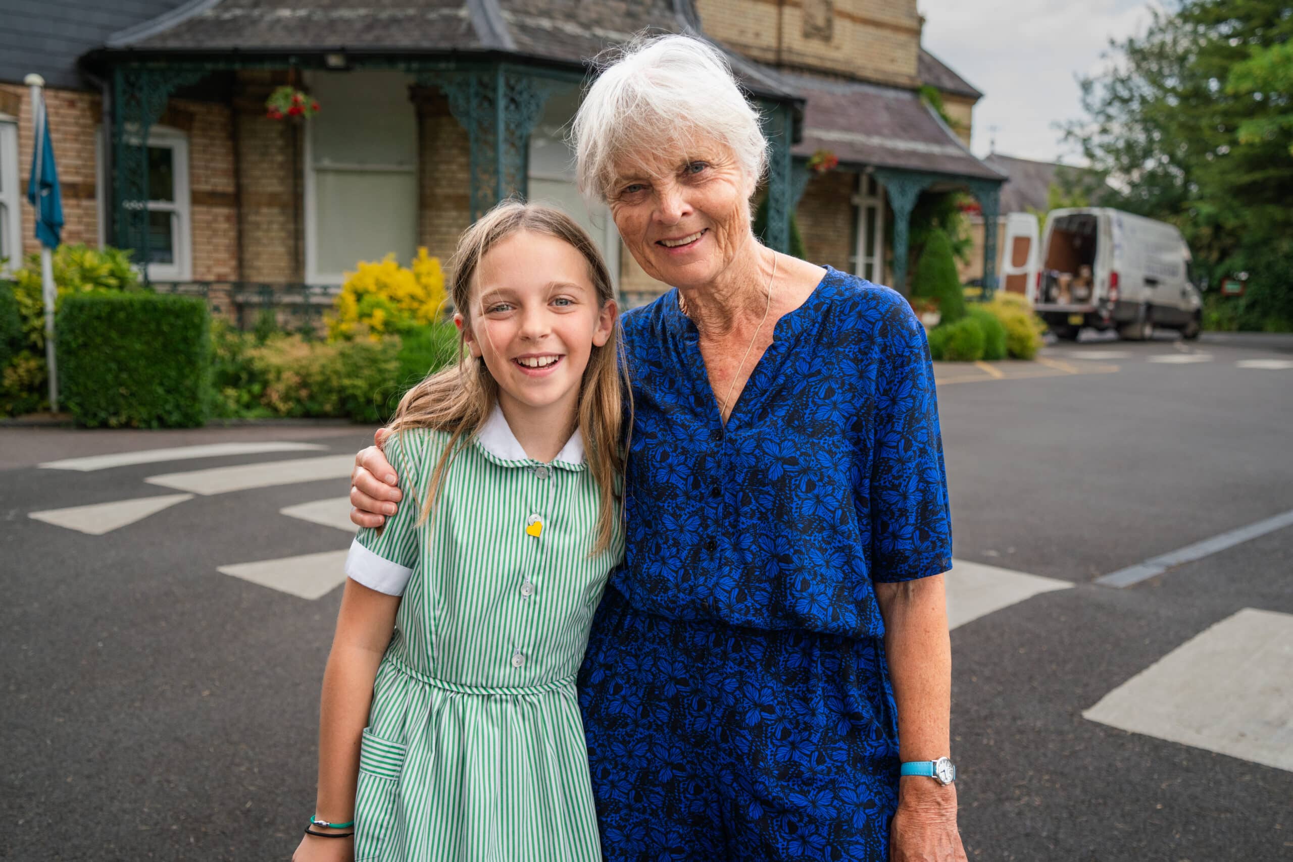 Long-term supporter Wendy and her granddaughter Grace, 11, outside Grace’s school.  Sebastian Solberg / Hope and Homes for Children 