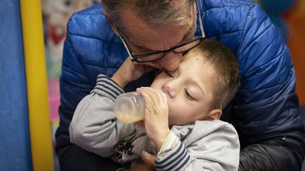 Stoyan kisses his son, Ivan, who has cerebral palsy. Father's Day Love