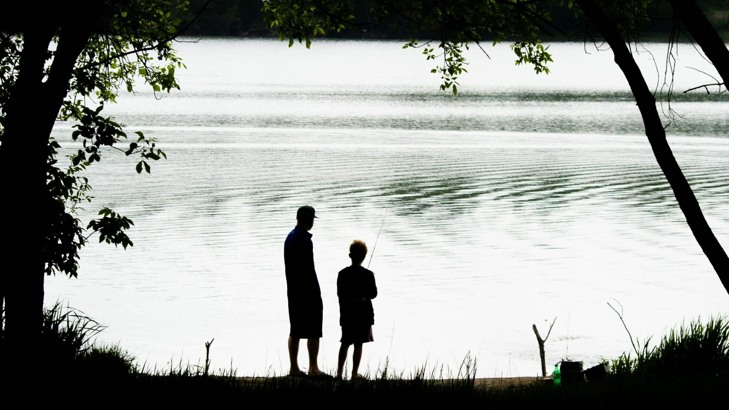 A child and a son go fishing. An image for Father's Day 