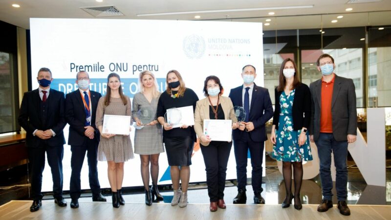 Liliana, from CCF Moldova, standing with her award alongside other winners