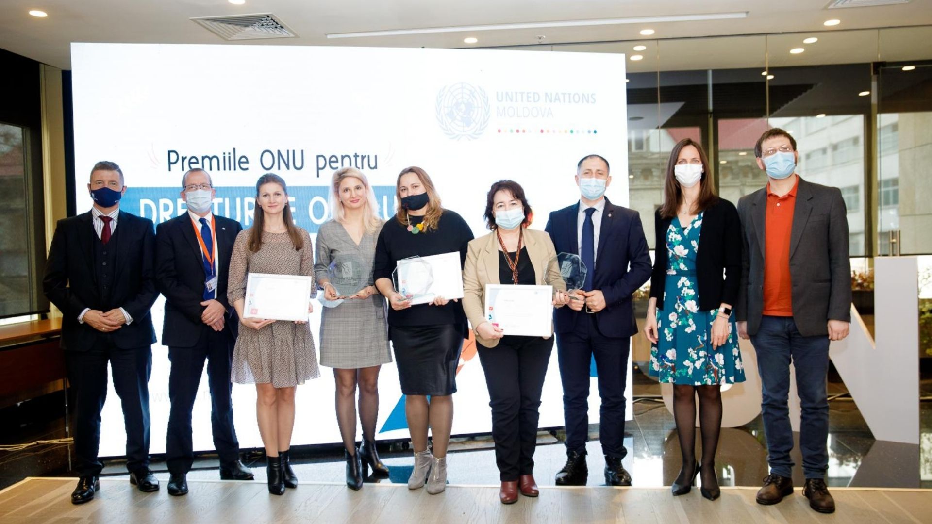 Liliana, from CCF Moldova, standing with her award alongside other winners
