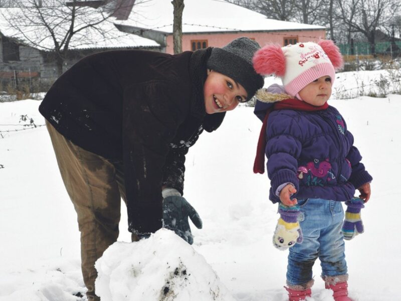 When Mihai lived in the orphanage, he was rarely allowed to play outside. Now that he’s back home thanks to CCF Moldova, he loves to play in the snow with his little sister, Amelia.
