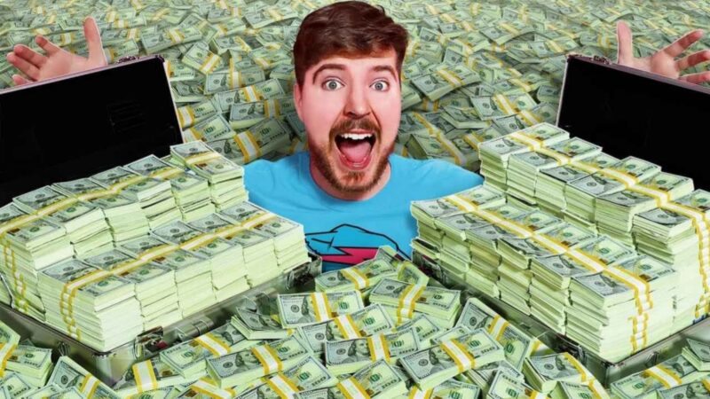 Mr Beast sat with lots of money around him