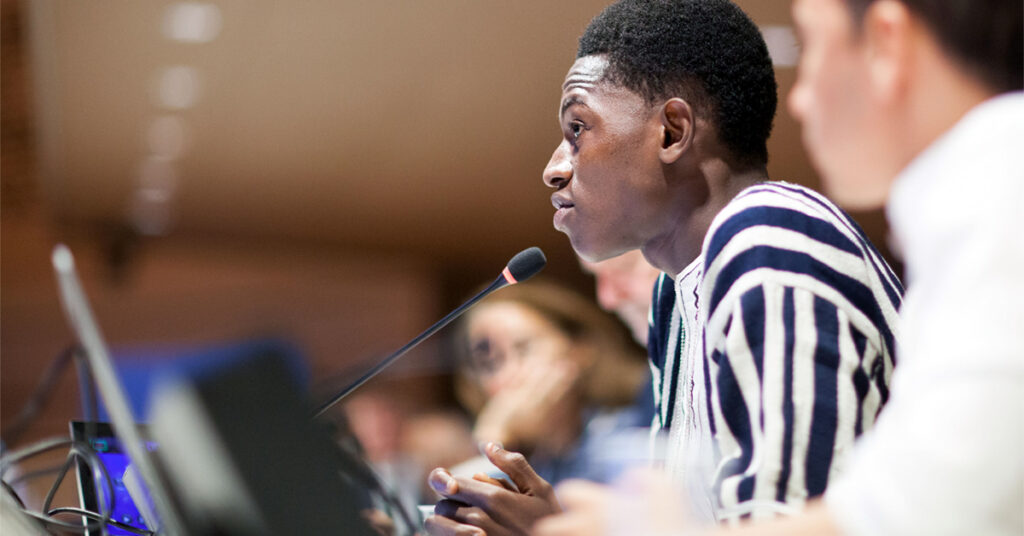 A female participants at the UNCRC’s 2018 Day of General Discussion including childcare reform