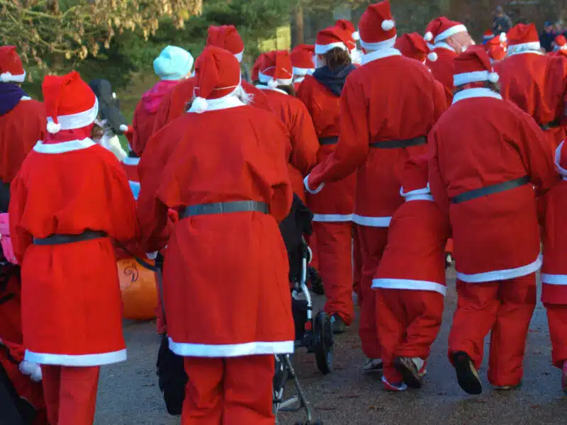 group of santas runing
